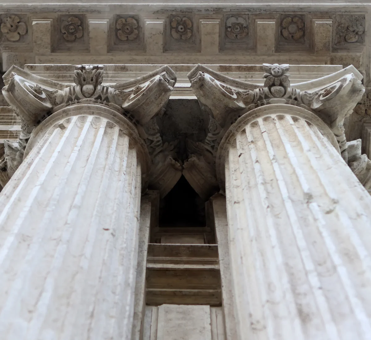 Classical stone columns seen from below