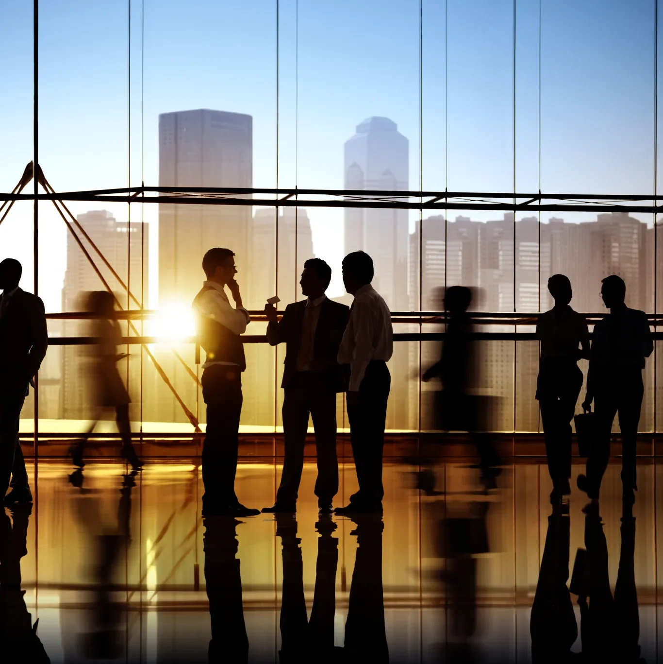 Professionals silhouetted against a city skyline